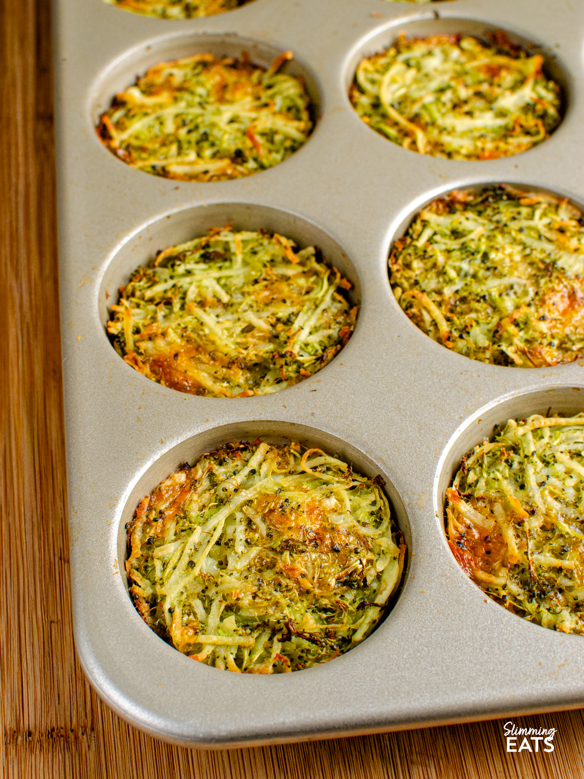 cooked broccoli potato cheddar hash browns in a muffin tray