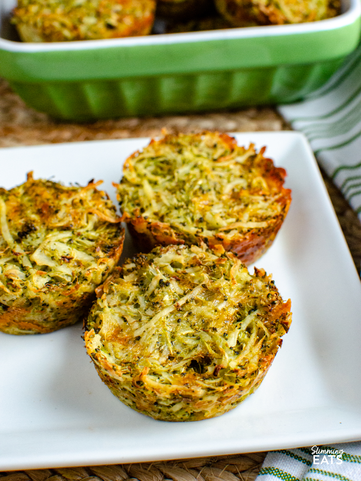 3 cooked broccoli potato cheddar hash browns on a white square plate