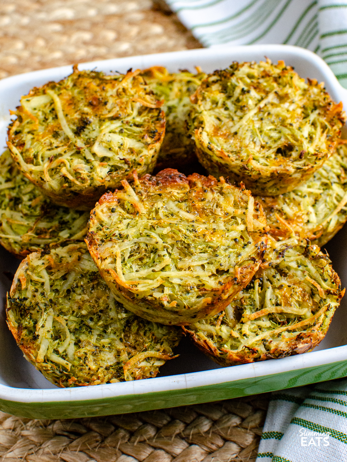 cooked broccoli potato cheddar hash browns in a green and white dish
