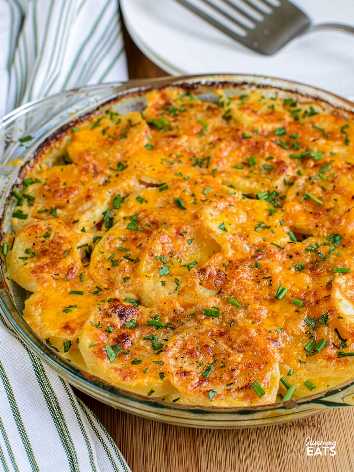 scalloped potatoes baked and out of oven ina glass round dish