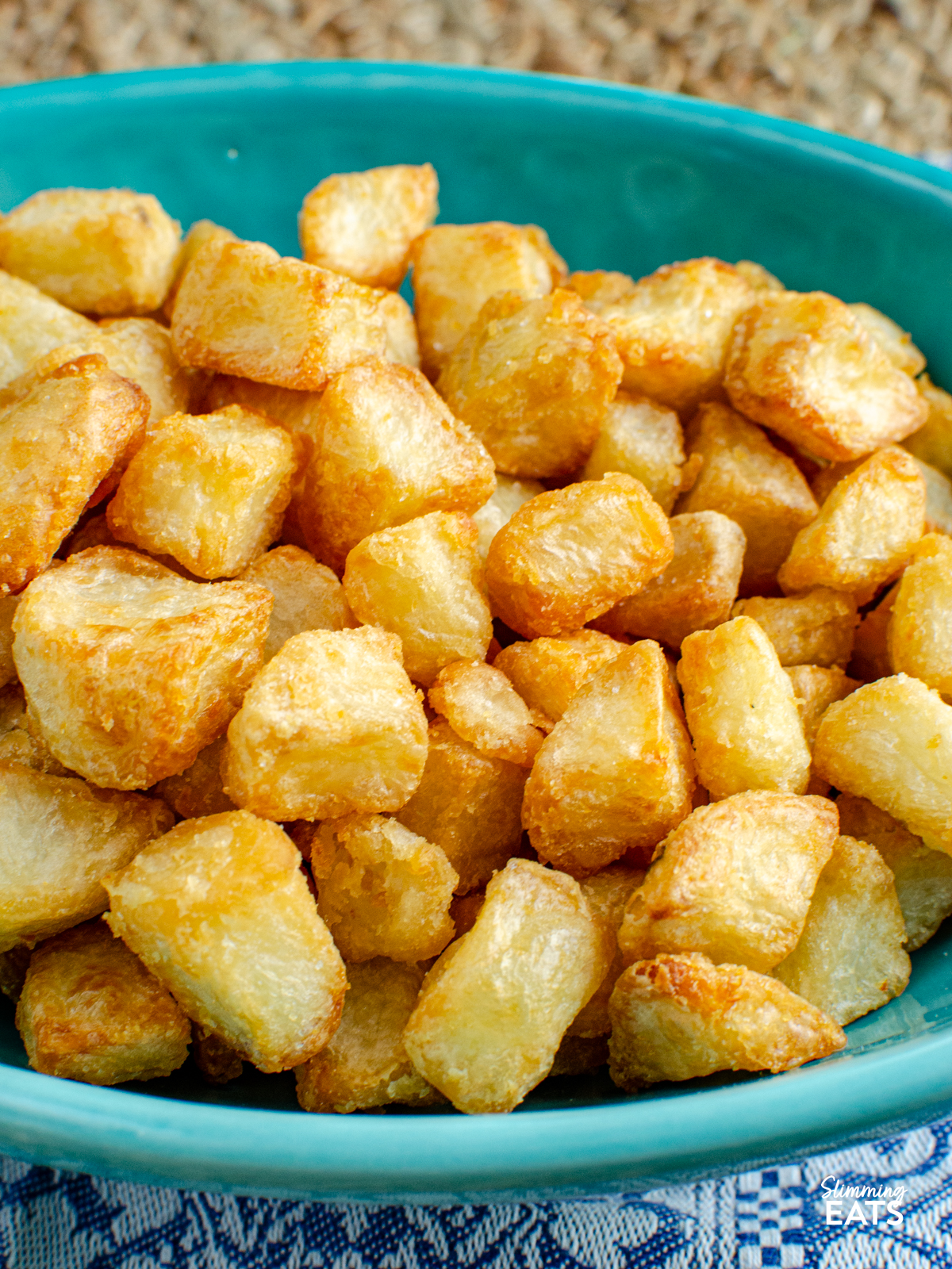 extra crispy potatoes in a turquoise dish 