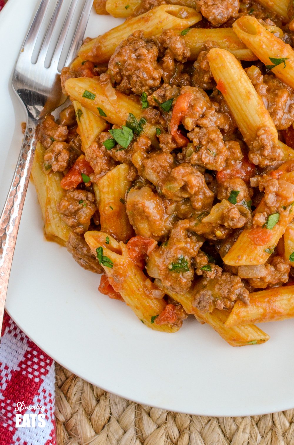 One Pot Cheeseburger Pasta on white plate with fork