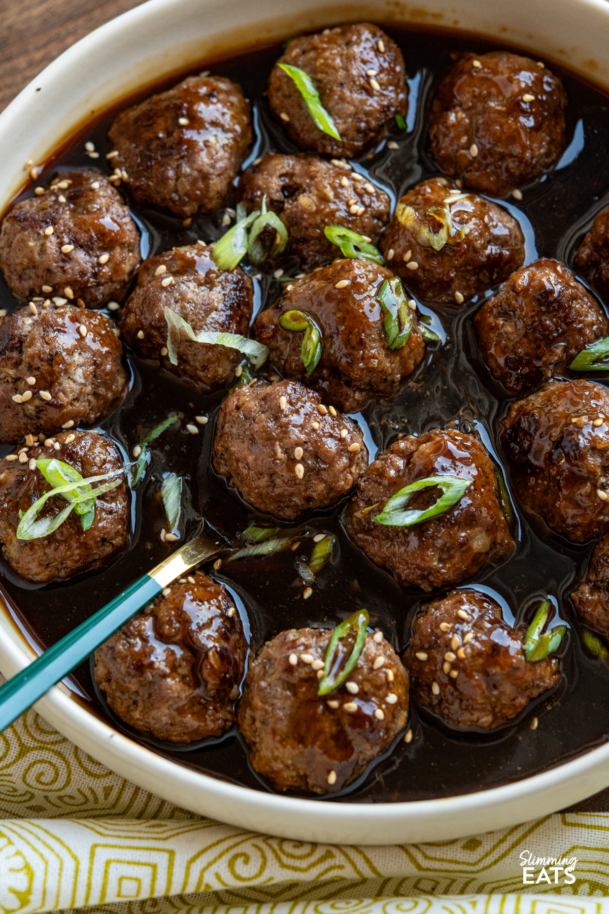 close up of Teriyaki Meatballs in a beige colour bowl