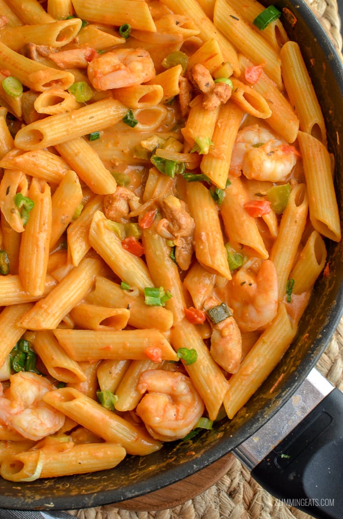 Dig into a bowl of this delicious spicy One Pot New Orleans Cajun Pasta - the only regret will be not having enough for seconds. Slimming Eats and Weight Watchers friendly close up New Orleans Cajun Pasta in black frying pan