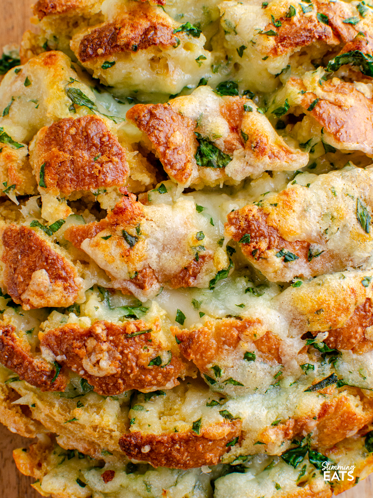 close up of out of oven cheesy oat garlic bread