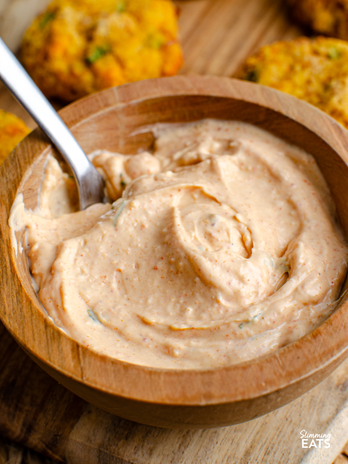 louisiana remoulade dip in a wooden bowl with spoon