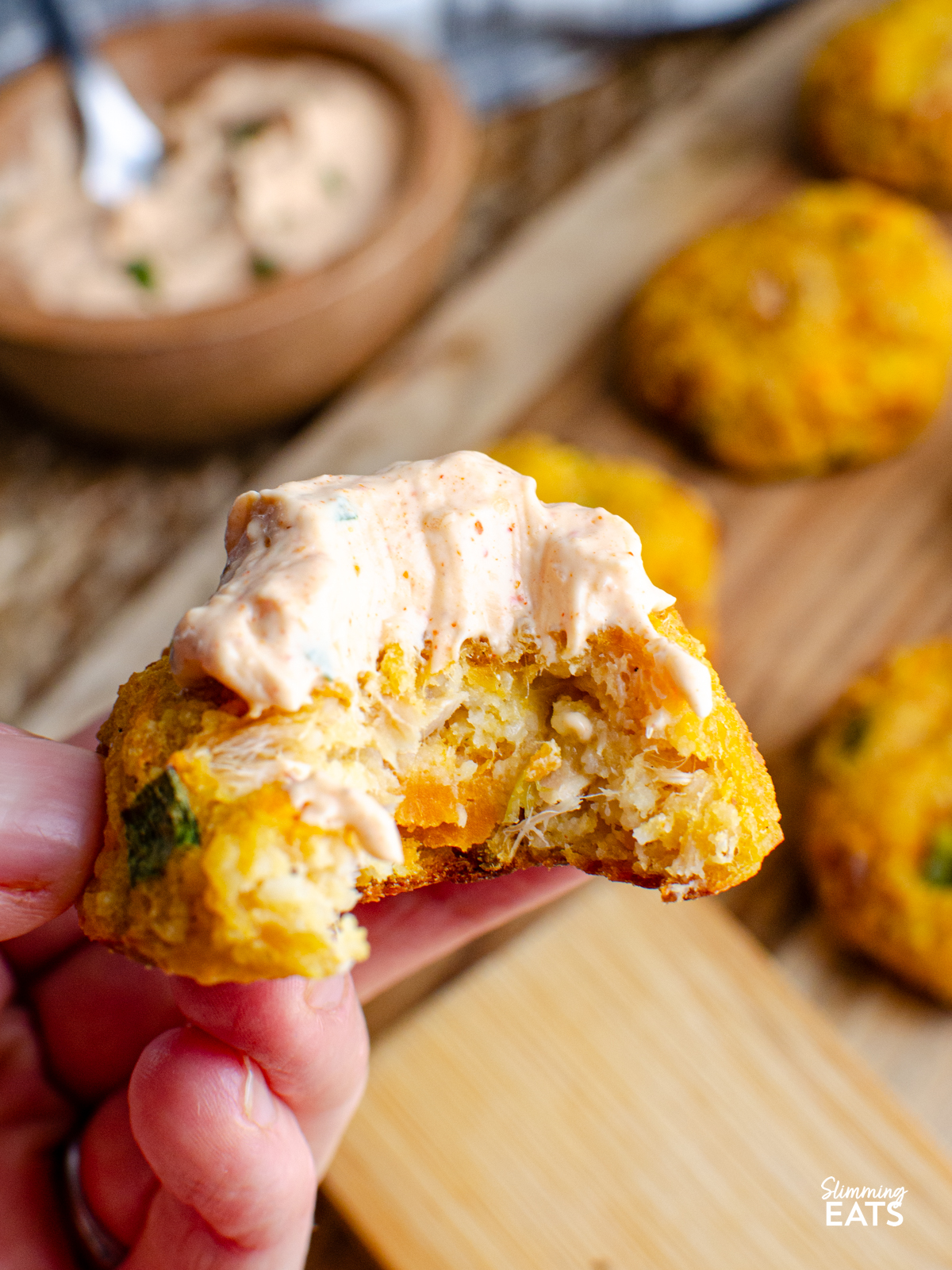 tuna couscous patty topped with louisiana remoulade with a bite taken out. 