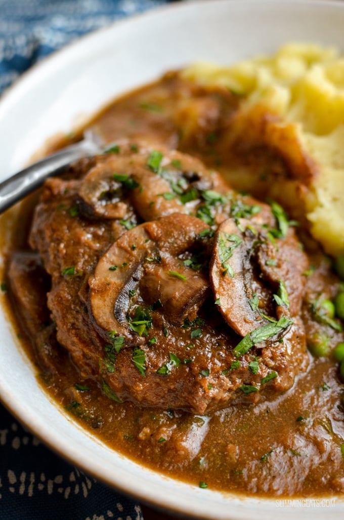 Enjoy a plate of this delicious Syn Free Salisbury Steak with Gravy - tender beef patties with hidden cauliflower smothered in a delicious rich mushroom onion gravy. Gluten Free, Dairy Free, Paleo, Whole30, Slimming World and Weight Watchers friendly | www.slimmingeats.com #slimmingworld #weightwatchers #paleo #beef #synfree #3points