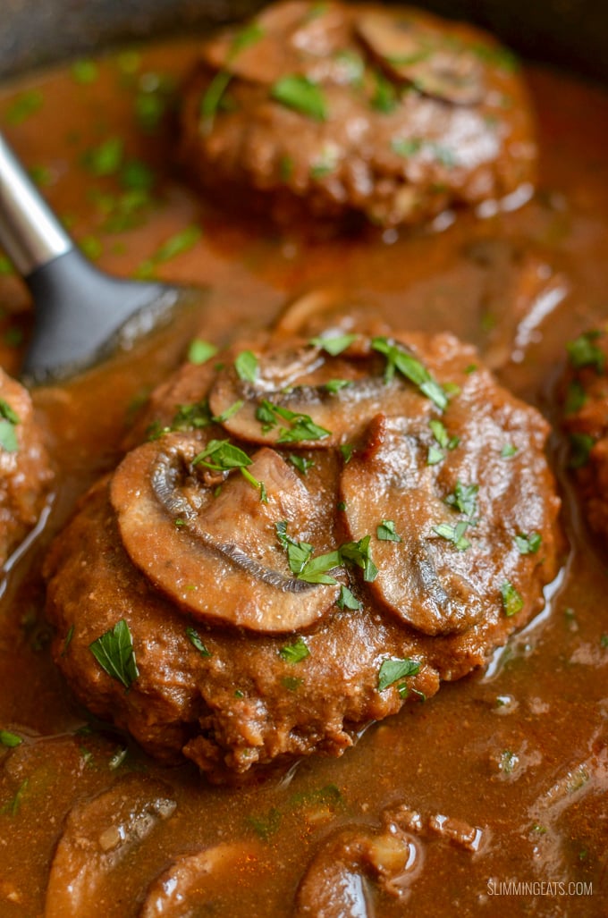 Enjoy a plate of this delicious Salisbury Steak with Gravy - tender beef patties with hidden cauliflower smothered in a delicious rich mushroom onion gravy. Gluten Free, Dairy Free, Paleo, Whole30, Slimming Eats and Weight Watchers friendly | www.slimmingeats.com #slimmingworld #weightwatchers #paleo #beef #3points