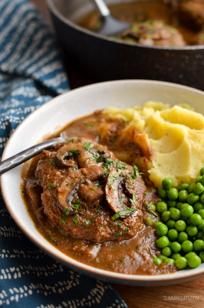 Enjoy a plate of this delicious Salisbury Steak with Gravy - tender beef patties with hidden cauliflower smothered in a delicious rich mushroom onion gravy. Gluten Free, Dairy Free, Paleo, Whole30, Slimming Eats and Weight Watchers friendly | www.slimmingeats.com #slimmingworld #weightwatchers #paleo #beef #3points