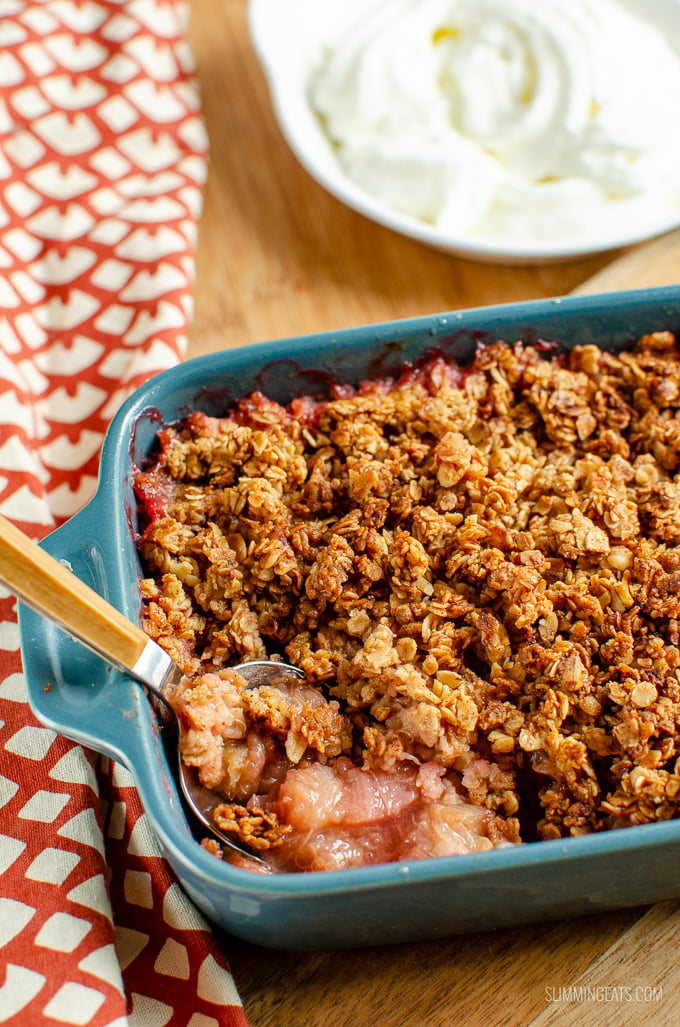 Nothing better than a delicious bowl of Cinnamon Oat Rhubarb Crumble - sweet tangy stewed rhubarb topped with a yummy golden topping. gluten free, dairy free, vegetarian, Slimming Eats and Weight Watchers friendly #slimmingworld #weightwatchers 