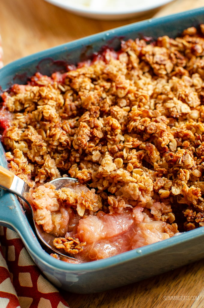 Nothing better than a delicious bowl of Cinnamon Oat Rhubarb Crumble - sweet tangy stewed rhubarb topped with a yummy golden topping. gluten free, dairy free, vegetarian, Slimming Eats and Weight Watchers friendly #slimmingworld #weightwatchers