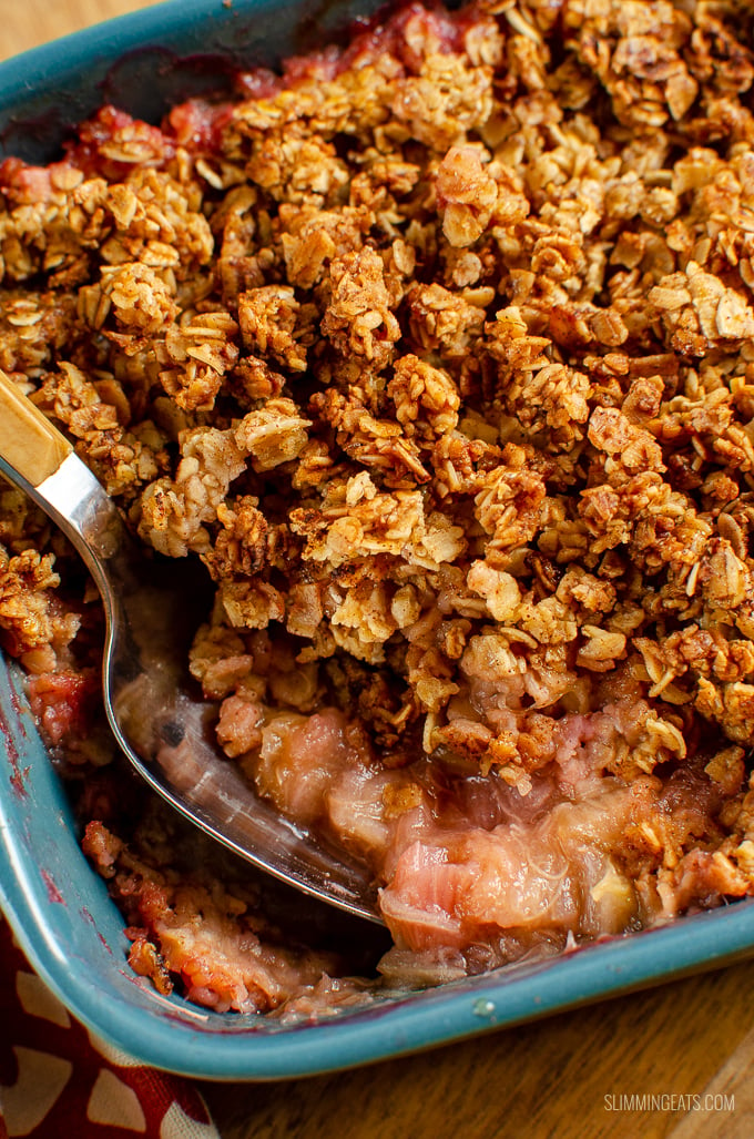 Nothing better than a delicious bowl of Cinnamon Oat Rhubarb Crumble - sweet tangy stewed rhubarb topped with a yummy golden topping. gluten free, dairy free, vegetarian, Slimming Eats and Weight Watchers friendly #slimmingworld #weightwatchers