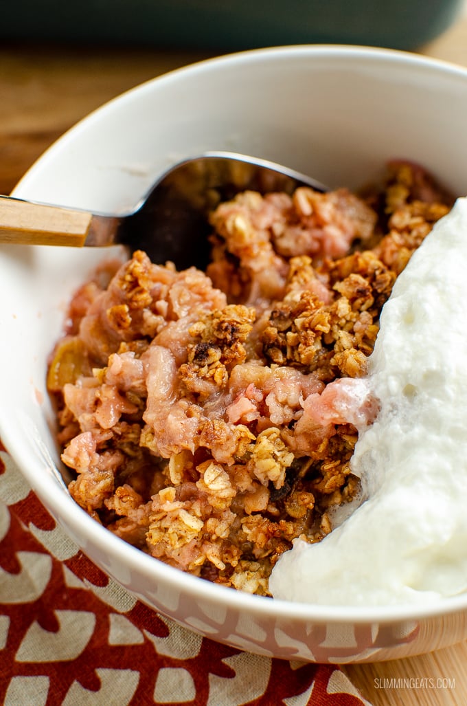 Nothing better than a delicious bowl of Cinnamon Oat Rhubarb Crumble - sweet tangy stewed rhubarb topped with a yummy golden topping. gluten free, dairy free, vegetarian, Slimming Eats and Weight Watchers friendly #slimmingworld #weightwatchers