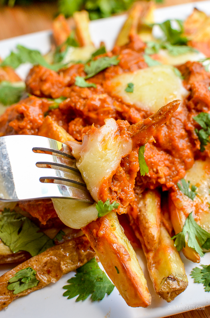 Butter Chicken Poutine!! - The ultimate dish for leftover butter chicken - crispy golden syn free fries, topped with butter chicken and melted cheese make this one of those recipes you will not ever want to end. Gluten Free, Slimming World and Weight Watchers friendly