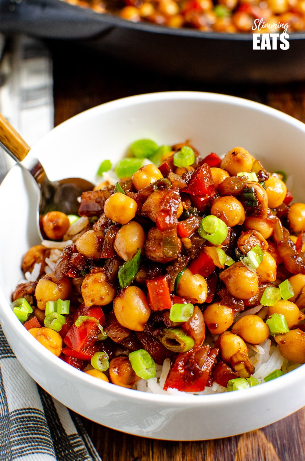 Chinese 5 spice Chickpeas - the perfect quick and easy recipe for anyone looking for a meat-free Chinese Fakeaway meal. Gluten free, dairy free, vegan, Slimming Eats and Weight Watcher friendly Chinese 5 spice Chickpeas in white bowl over rice