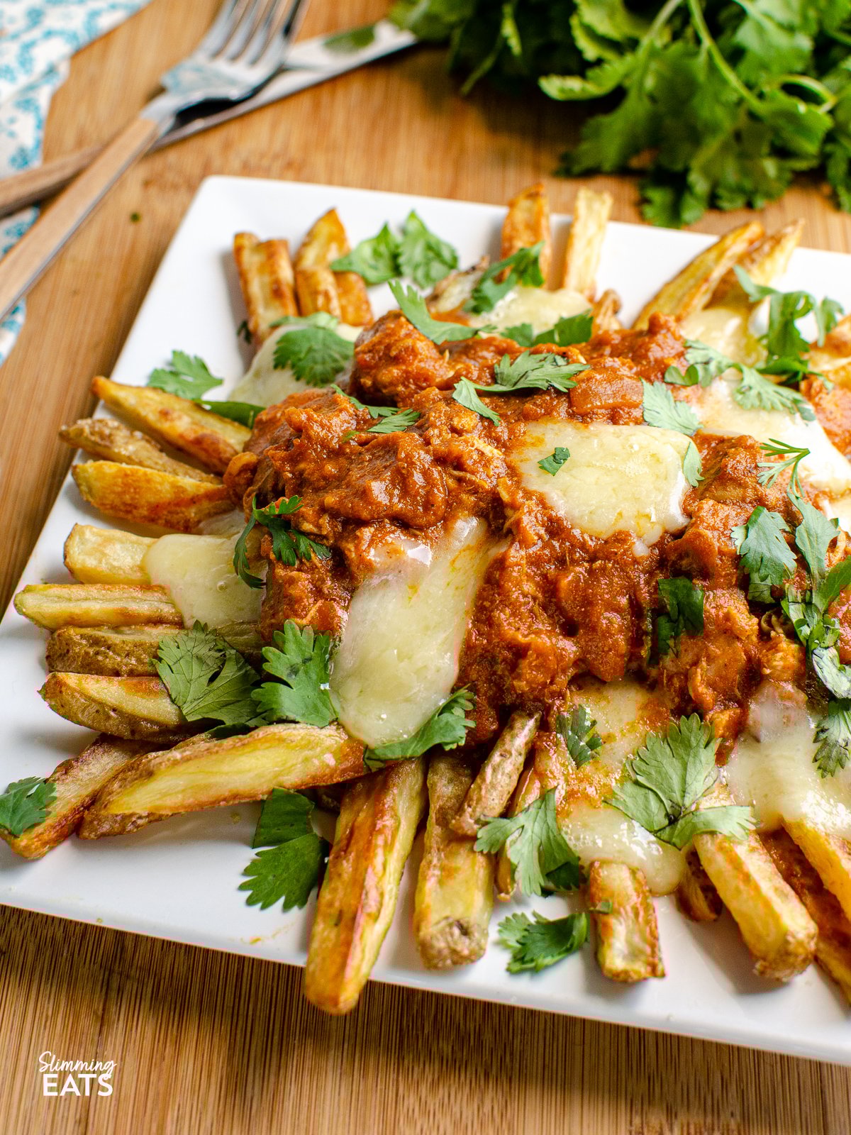 Butter Chicken Poutine!! - The ultimate dish for leftover butter chicken - crispy golden fries, topped with butter chicken and melted cheese make this one of those recipes you will not ever want to end. Gluten Free