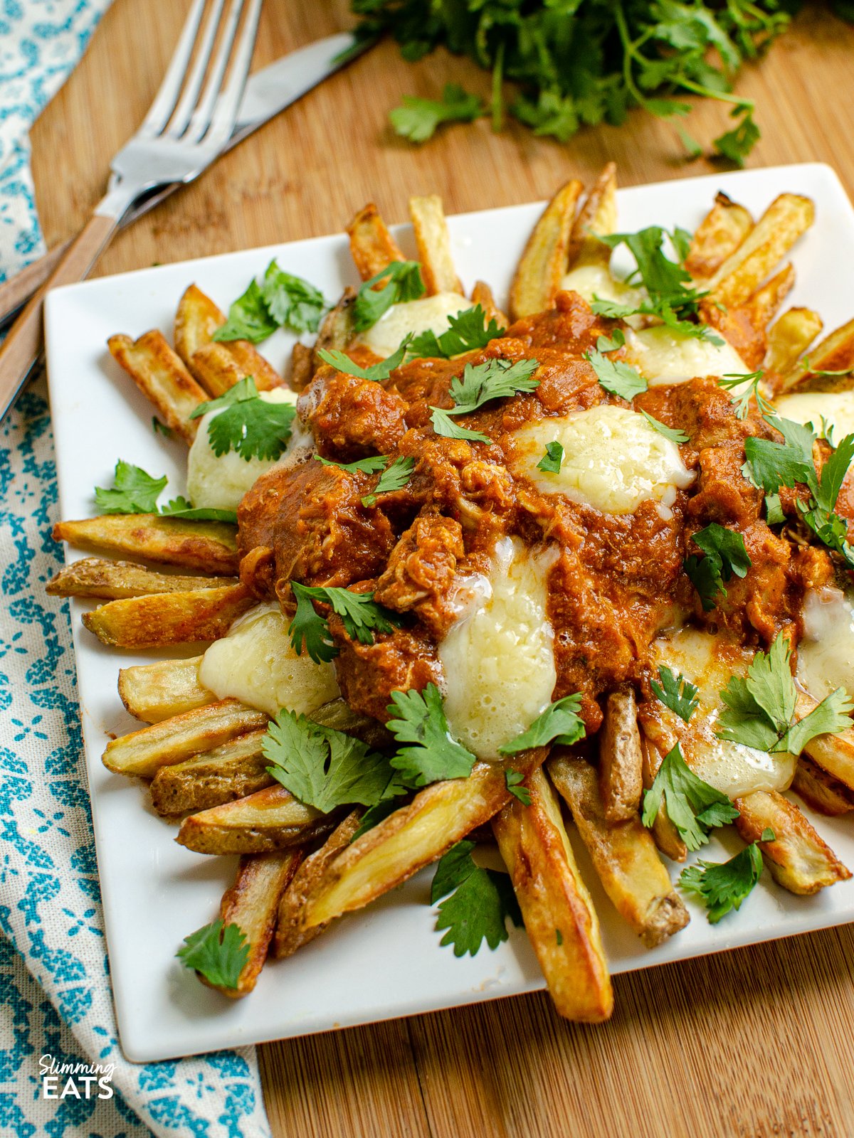Butter Chicken Poutine!! - The ultimate dish for leftover butter chicken - crispy golden fries, topped with butter chicken and melted cheese make this one of those recipes you will not ever want to end. Gluten Free