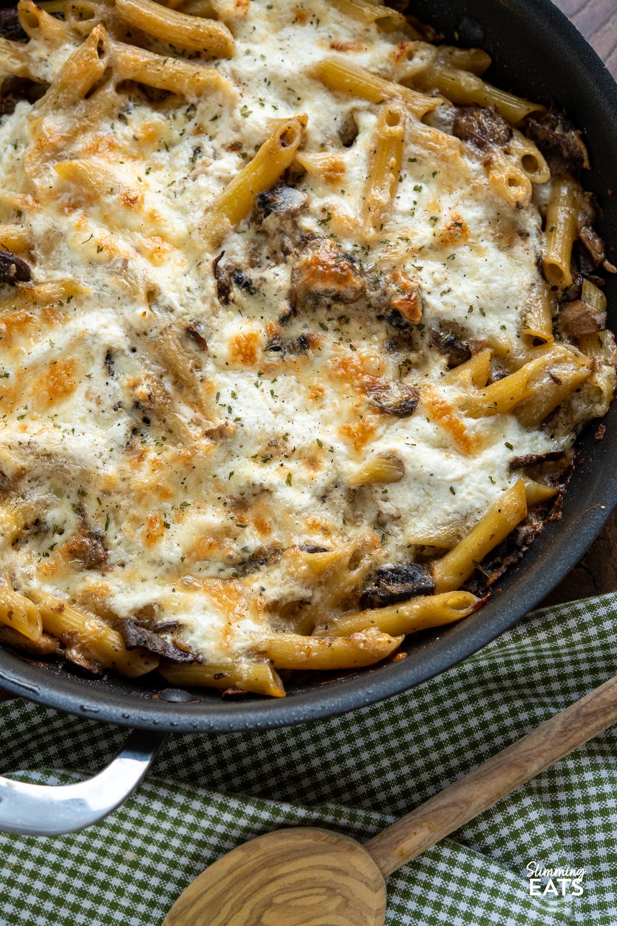 Dig into a bowl of this Baked Garlic Mushroom and Ricotta Pasta dish - garlicky, cheesy and delicious!! close up of Baked Garlic Mushroom and Ricotta Pasta in frying pan