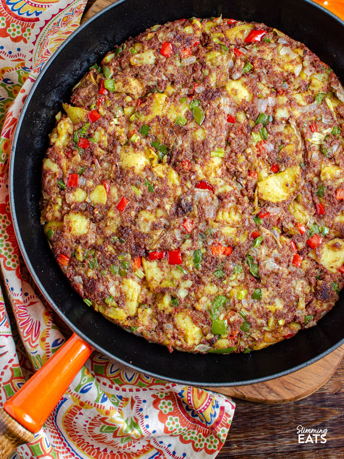 Corned Beef Hash  in a cast iron orange Le Creuset skillet