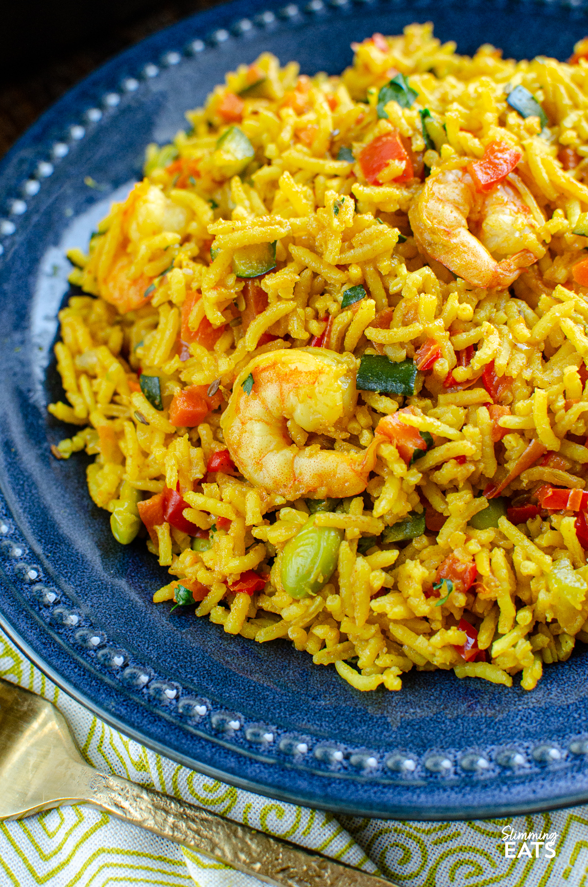 close up of One Pot Prawn and Vegetable Pilaf on navy plate 