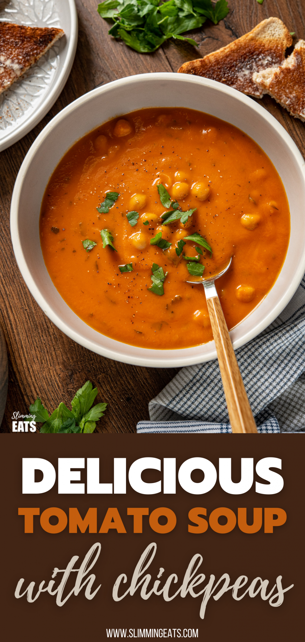 chickpeas and tomato soup in grey bowl with spoon and scattered parsley