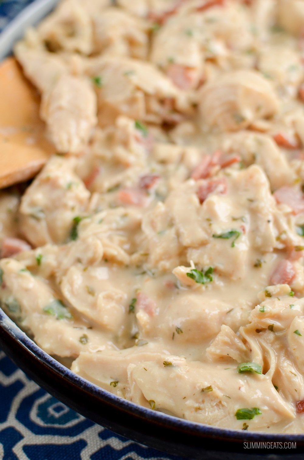 Healthier Slow Cooker Crack Chicken - the ultimate family-friendly creamy chicken recipe topped with the yummy smokey flavour of bacon. Oh my!! #slimming #weightwatchers #chicken #slowcooker #glutenfree #bacon #creamy close up of slow cooker crack chicken in dish