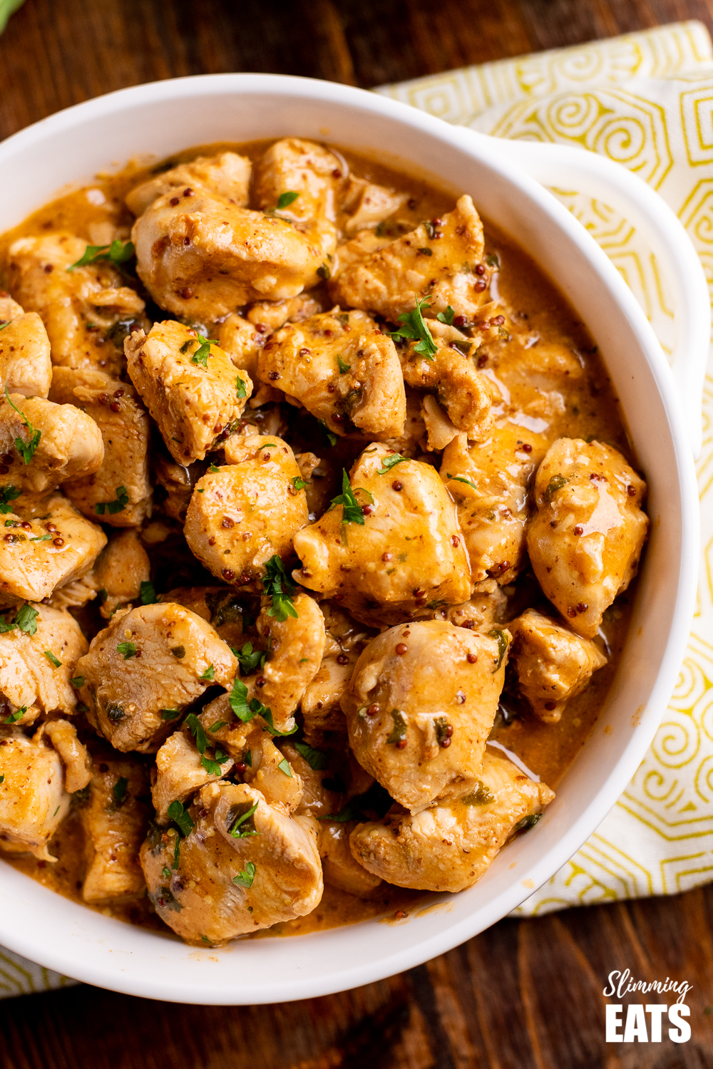 instant pot honey mustard chicken in white dish on pattern placemat 