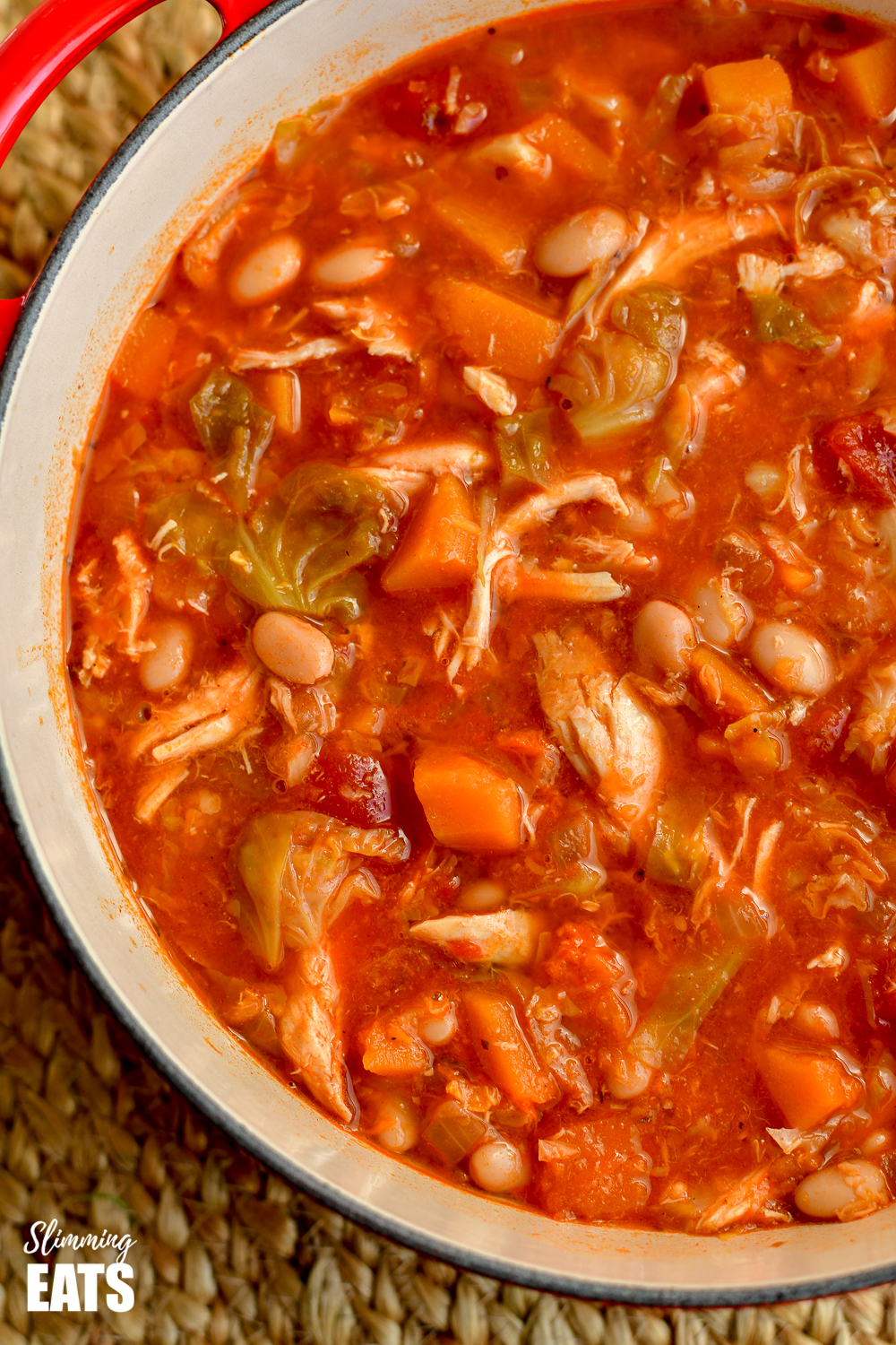 close up of leftover chicken Brussels sprouts, and bean soup in dutch oven pot