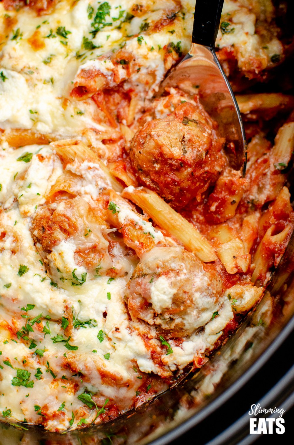 close up of slow cooker chicken meatballs pasta bake