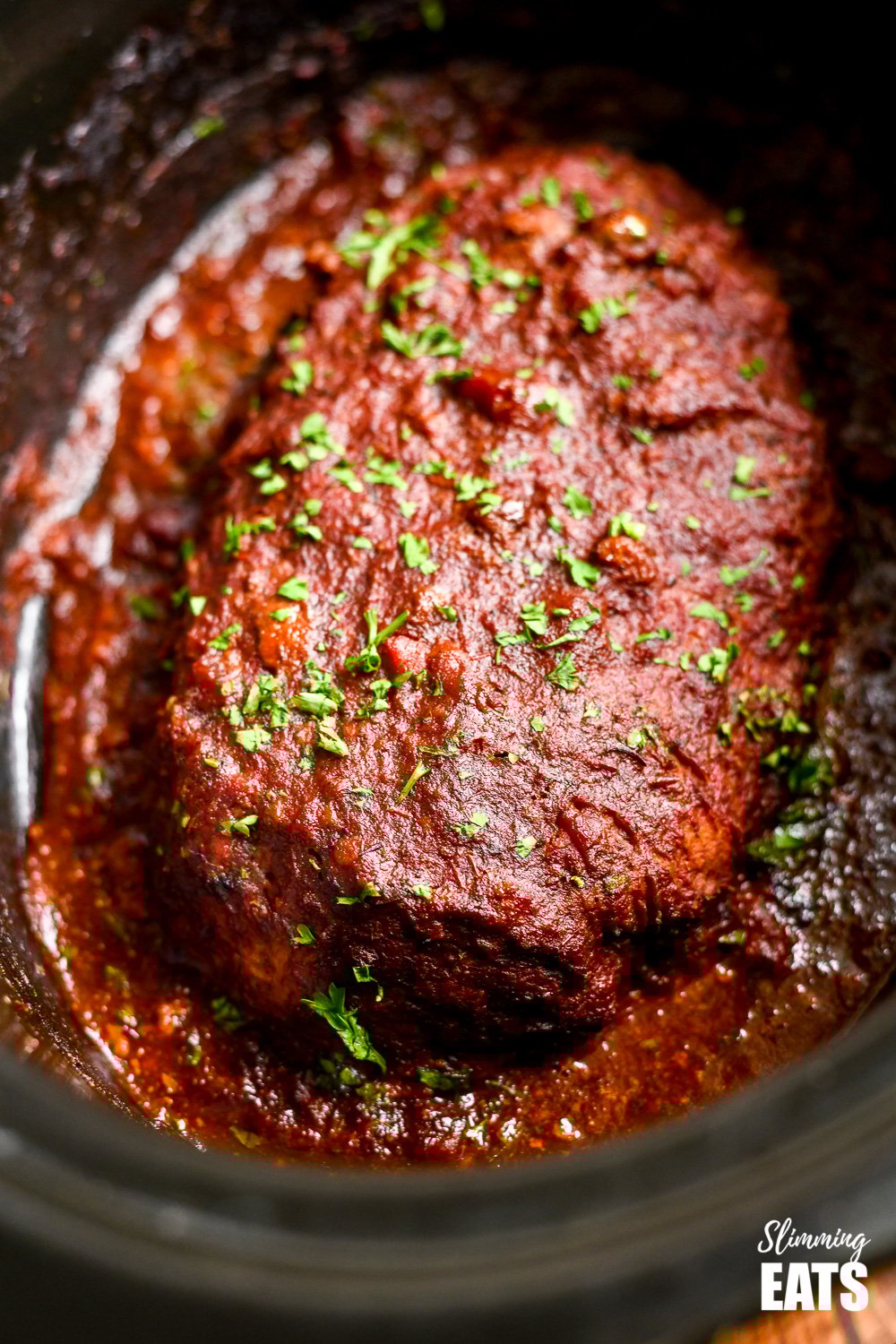 Slow Cooker Chicken Mushroom Meatloaf - a super easy recipe for a tender delicious meatloaf with the yummy rich flavour of mushrooms all topped with a delicious tomato glaze. slow cooker chicken mushroom meatloaf in the dish in slow cooker