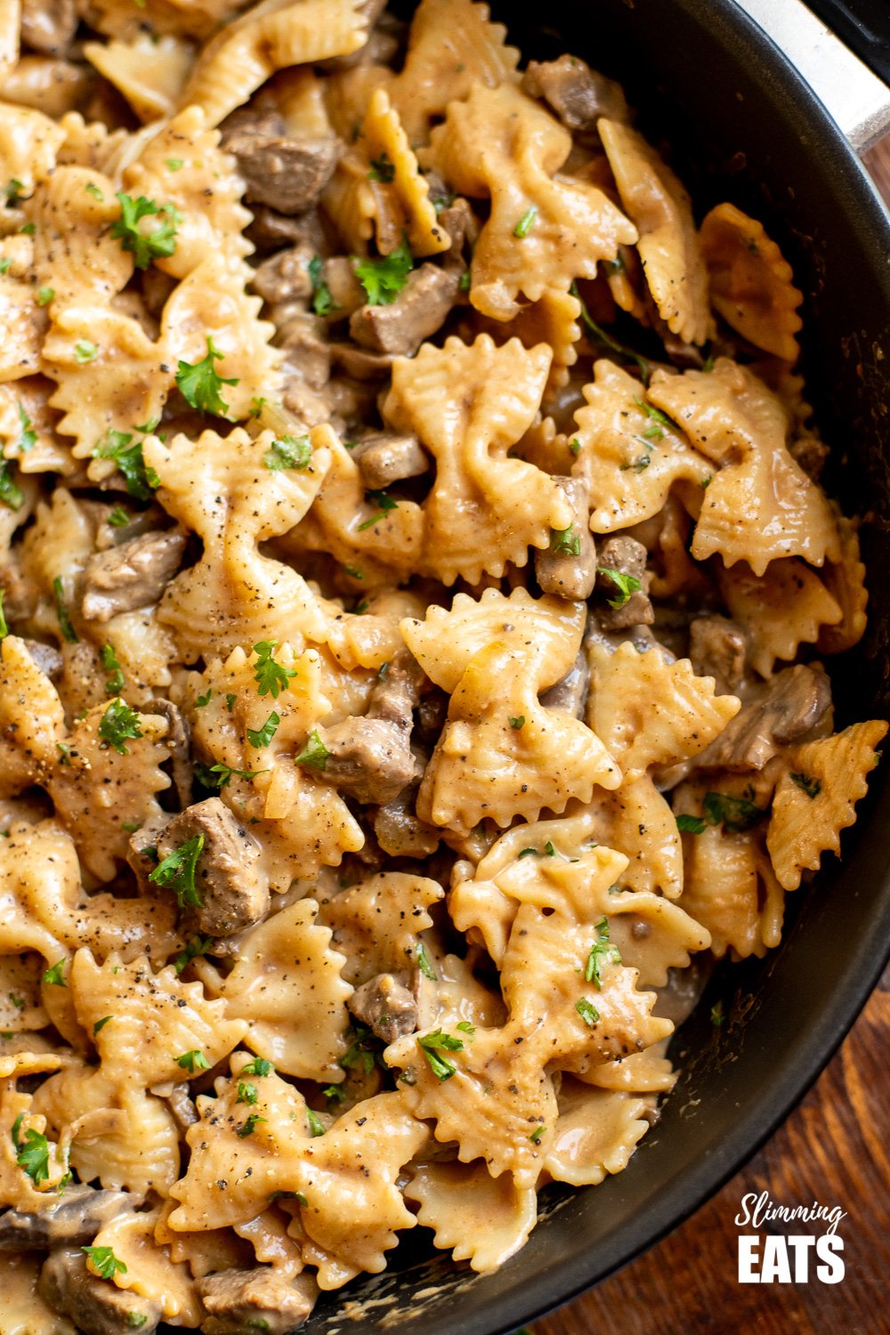 close up of one pot beef stroganoff pasta in black frying pan