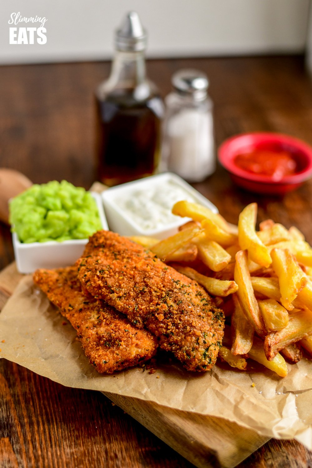 Actifry fish and chips on parchment with mushy peas and tartare sauce