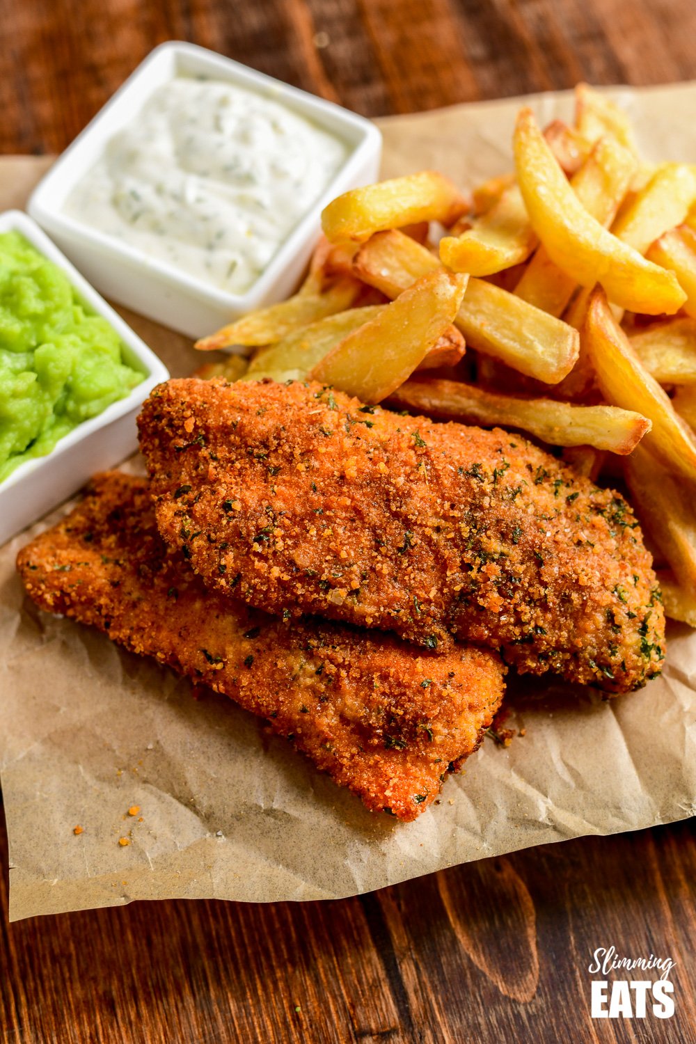 close up of actifry fish and chips on crinkled parchment paper