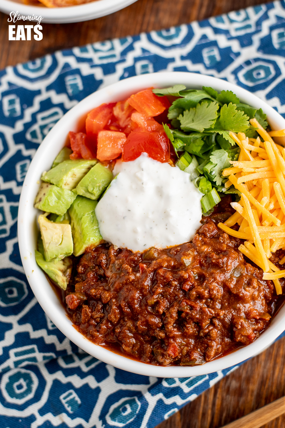 instant pot chocolate chilli in white bowl on blue placemat