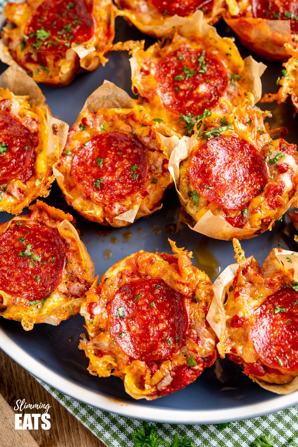 batch of Pepperoni Pizza Egg Bites on a blue plate