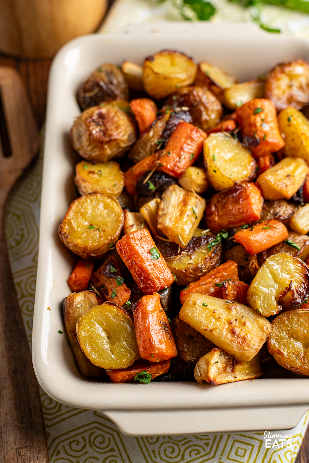 close up of Rosemary Roasted Potatoes, Parsnips, Carrots and Onion in a dish