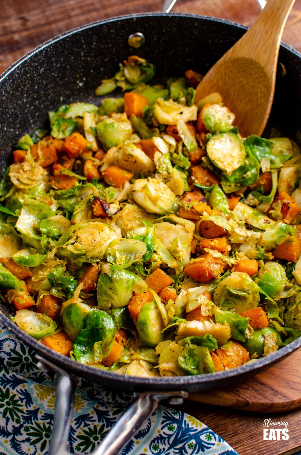 Sautéed Brussel Sprouts with Roasted Butternut Squash in deep frying pan