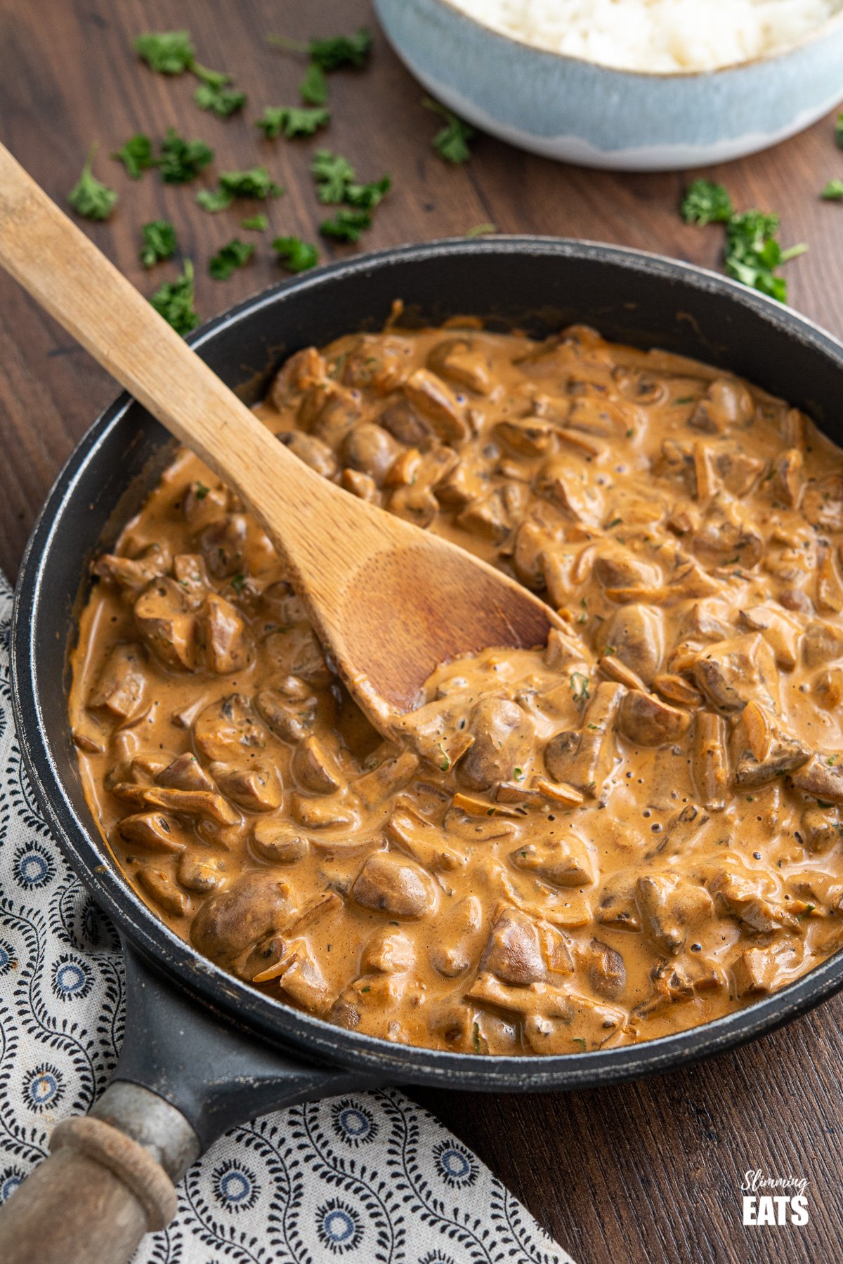 Creamy Mushroom Stroganoff in black frying pan with wooden handle