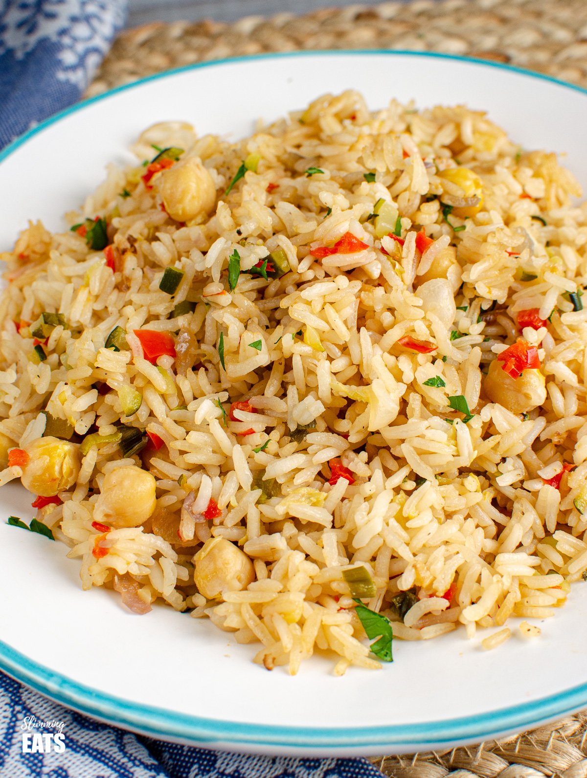 Chickpea Vegetable Rice Pilaf on white plate with blue rim