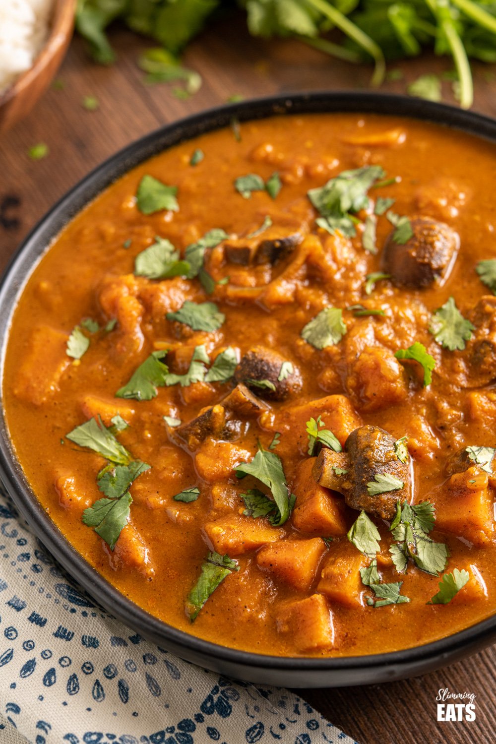 Sweet Potato and Mushroom Curry in Black Bowl