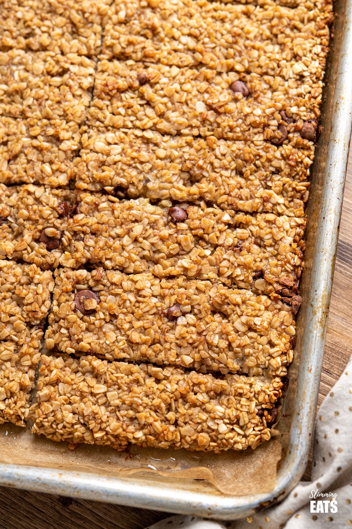 close up of Healthy Chocolate Chip Banana Granola Bars on a baking tray 