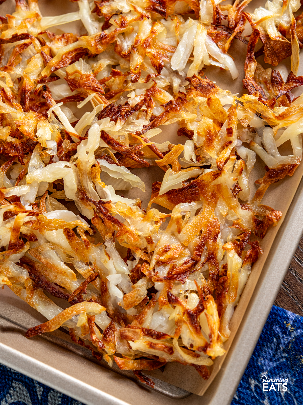 sheet pan hash browns cooked on parchment lined tray