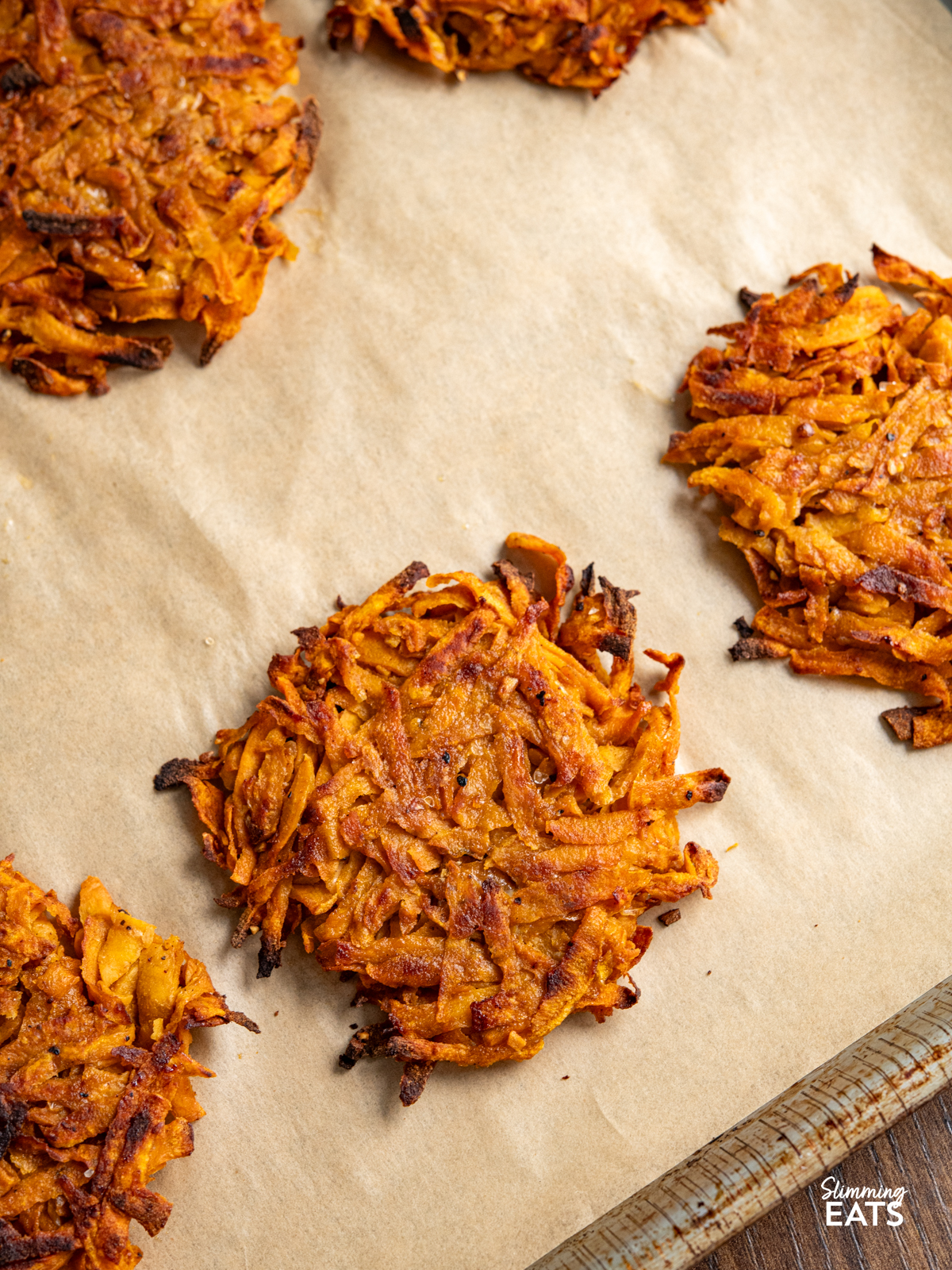 sweet potato hash browns all cooked on a parchment lined tray