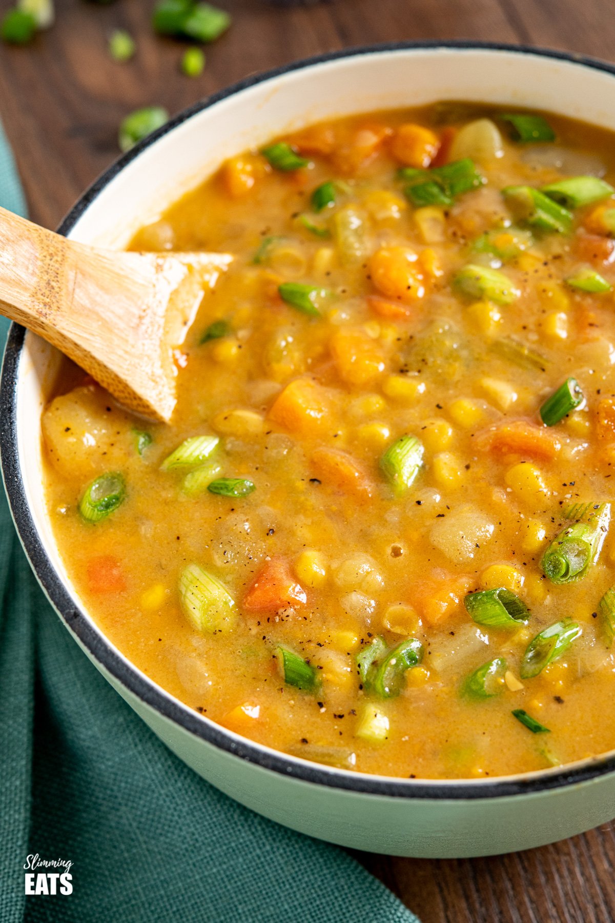 close up of creamy vegetable vegan chowder in cast iron saucepan