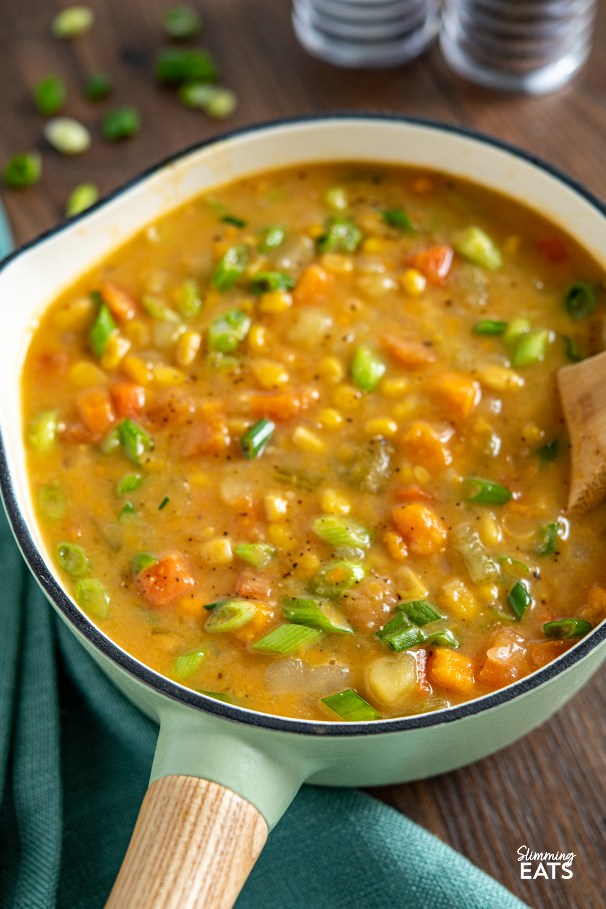 Creamy Vegan Vegetable Chowder - this chowder is delicious and packed with healthy vegetables. Perfect for those cold chilly fall and winter months. #vegan #glutenfree #dairyfree #slimmingeats #weightwatchers close up of creamy vegetable vegan chowder in cast iron saucepan