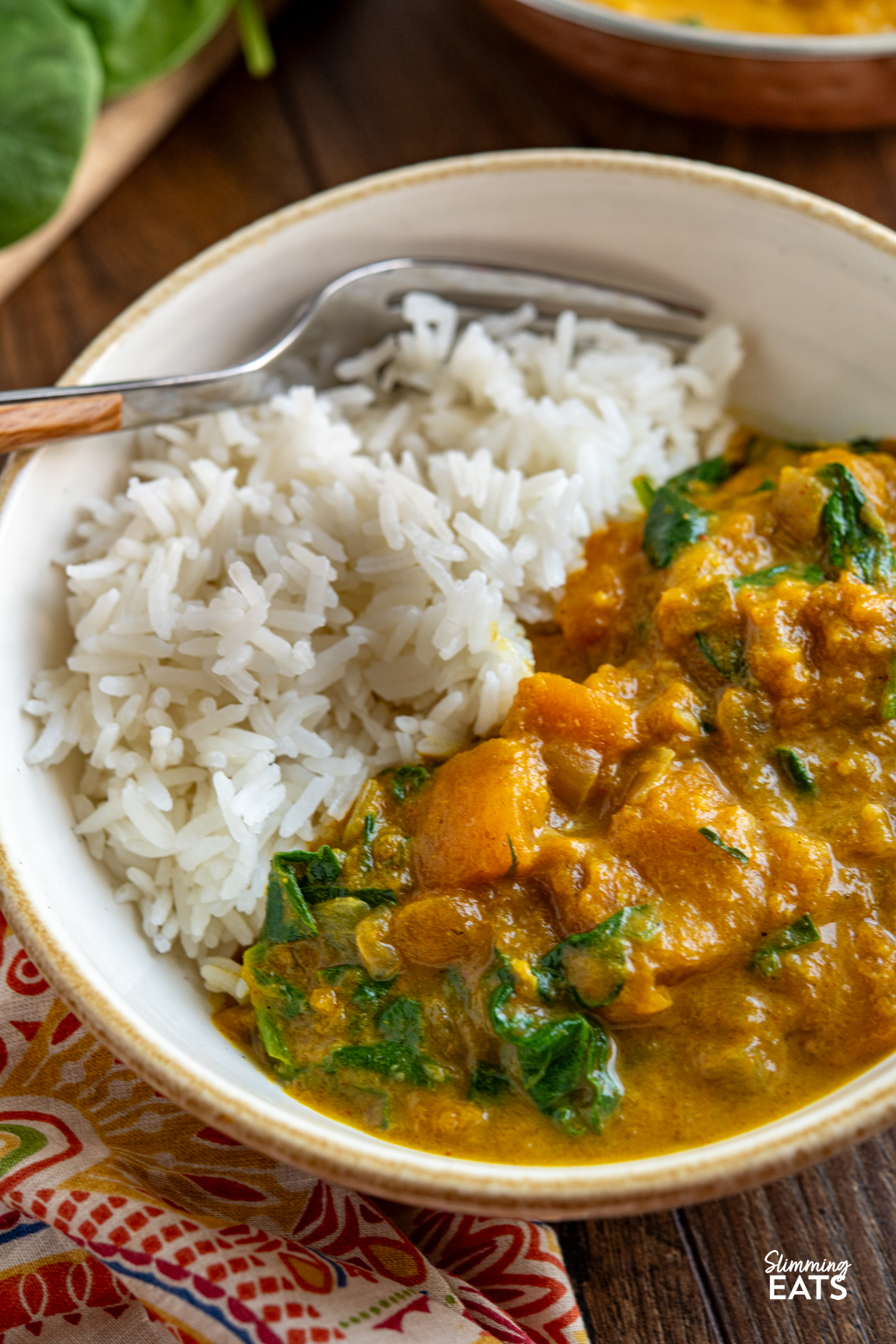 Easy Butternut Squash Curry with Spinach - a simple delicious vegan curry with chunks of butternut squash and a creamy coconut curry sauce. It's a perfect recipe for the whole family. #vegan #vegetarian #butternutsquash #curry #coconut #slimmingeats #weightwatchers