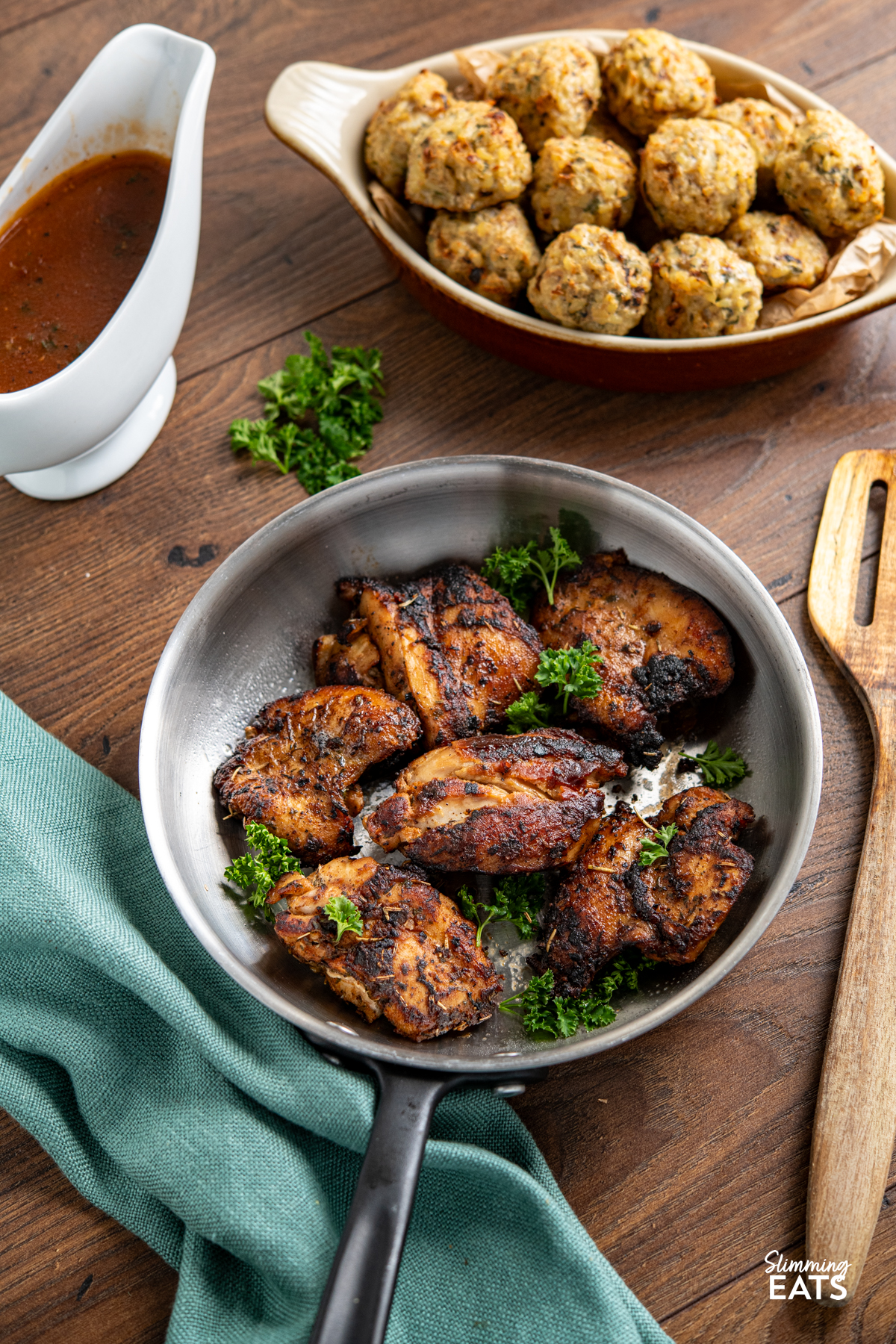 Seasoned Chicken with Rich Gravy - deliciously tender chicken thighs with seasoning and herbs paired with a delicious rich gravy. #glutenfree #dairyfree #chicken #gravy #slimmingeats #weightwatchers #smartpoints Seasoned Chicken in frying pan pan with just of Rich Gravy in background