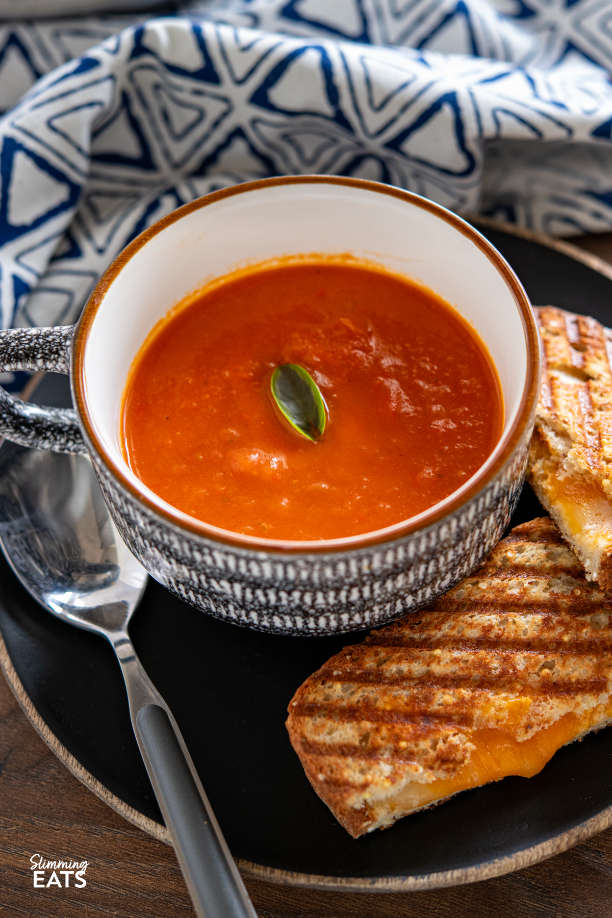 Roasted Red Pepper and Tomato Soup - a simple but delicious soup made with fresh peppers and tomatoes perfect with a grilled cheese sandwich. Gluten Free, Dairy Free, Vegan, Vegetarian, Slimming Eats and Weight Watchers friendly Roasted Red Pepper and Tomato Soup in cup with grilled cheese