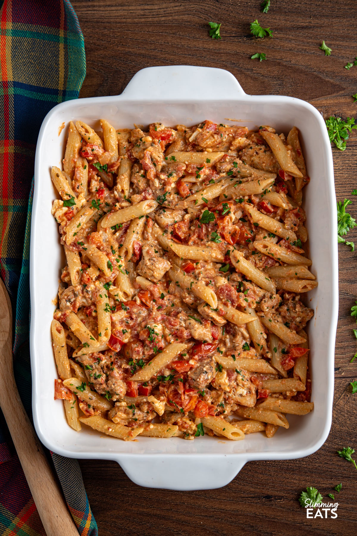 Baked Feta Pasta - a delicious variation of this popular recipe with tender chicken, tomatoes, red pepper, seasonings and penne pasta. Slimming Eats and Weight Watchers friendly Baked feta pasta in white oven dish with chicken